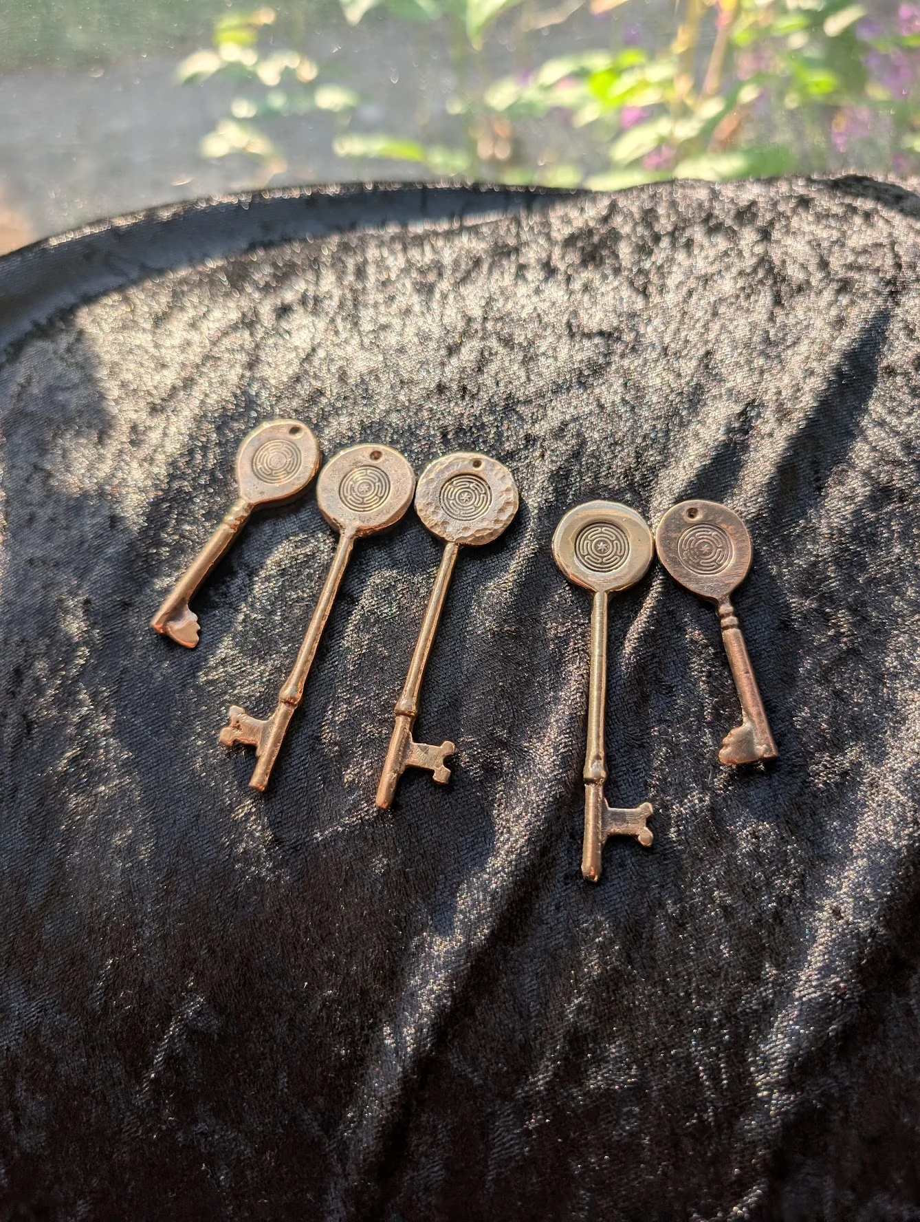 Cast bronze strophalos keys with Hekate's wheel medallion tops by BorboroForge