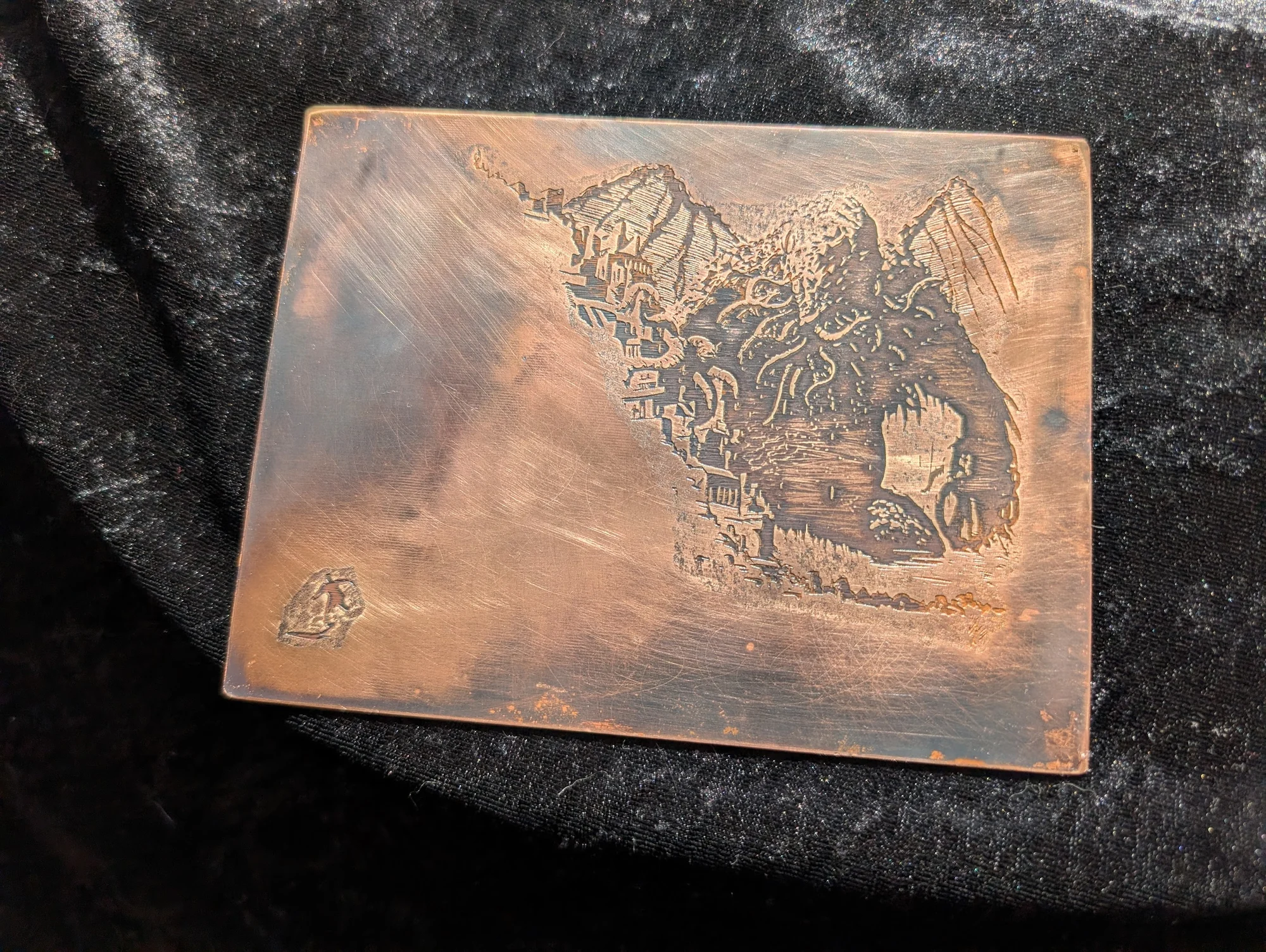 Hand-etched Cthulhu design on reclaimed metal plate by BorboroForge