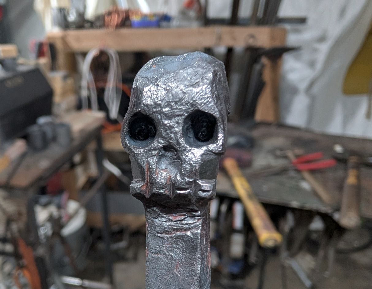 Hand-forged metal skull sculpture by BorboroForge