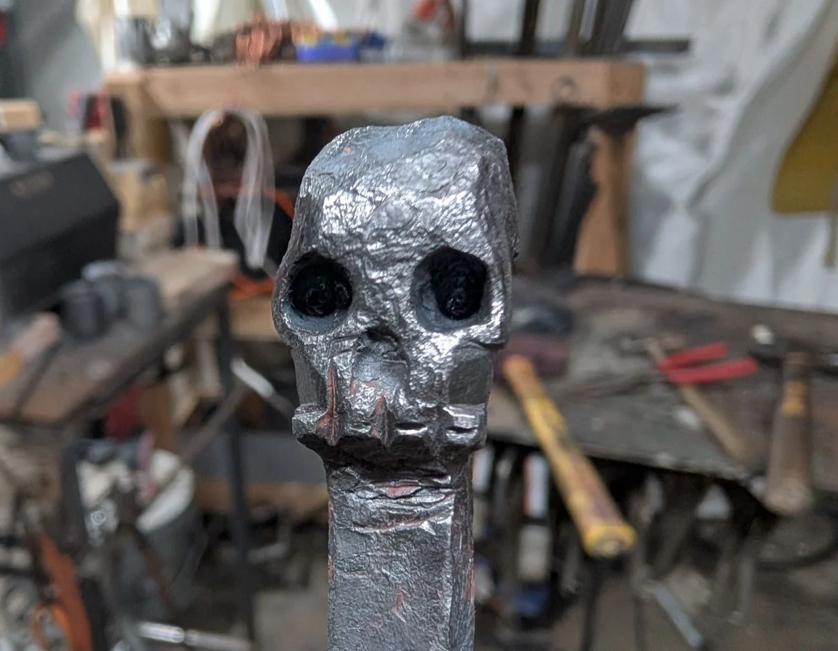 Hand-forged metal skull sculpture by BorboroForge
